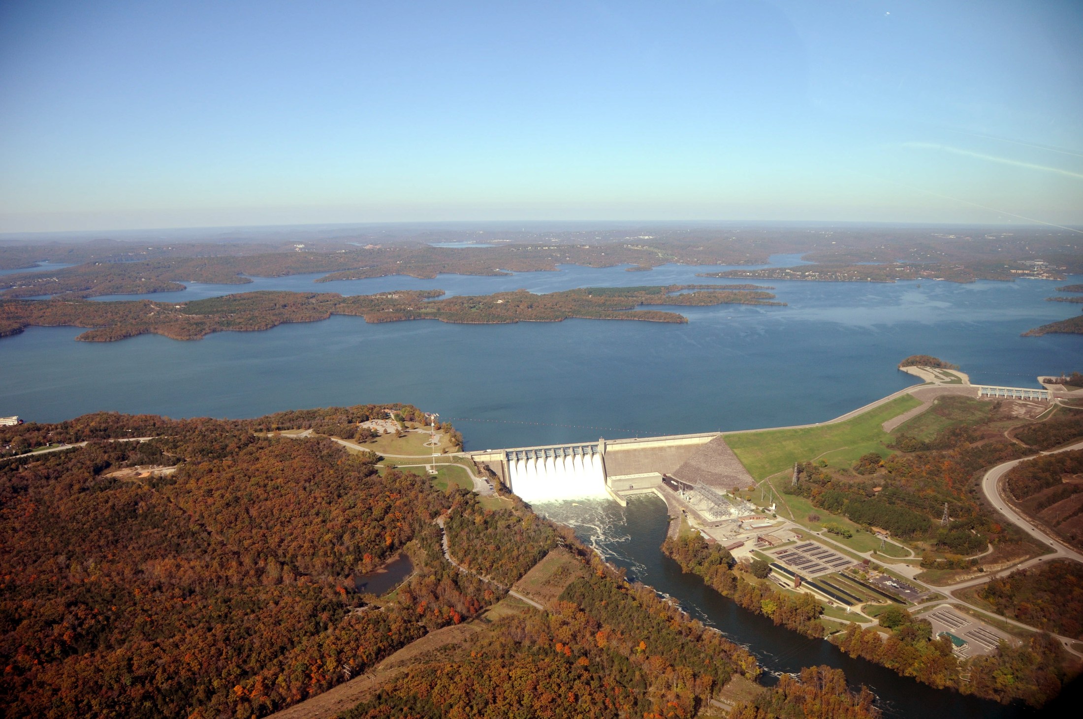 An aerial view of Table Rock Lake and Dam near Branson, Missouri, surrounded by wooded Ozarks hills in October 2009.